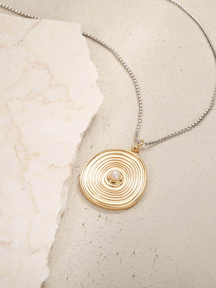 An annual gold coin necklace for everyday wear