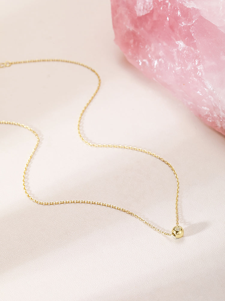 A delicate little ball necklace for a female girl